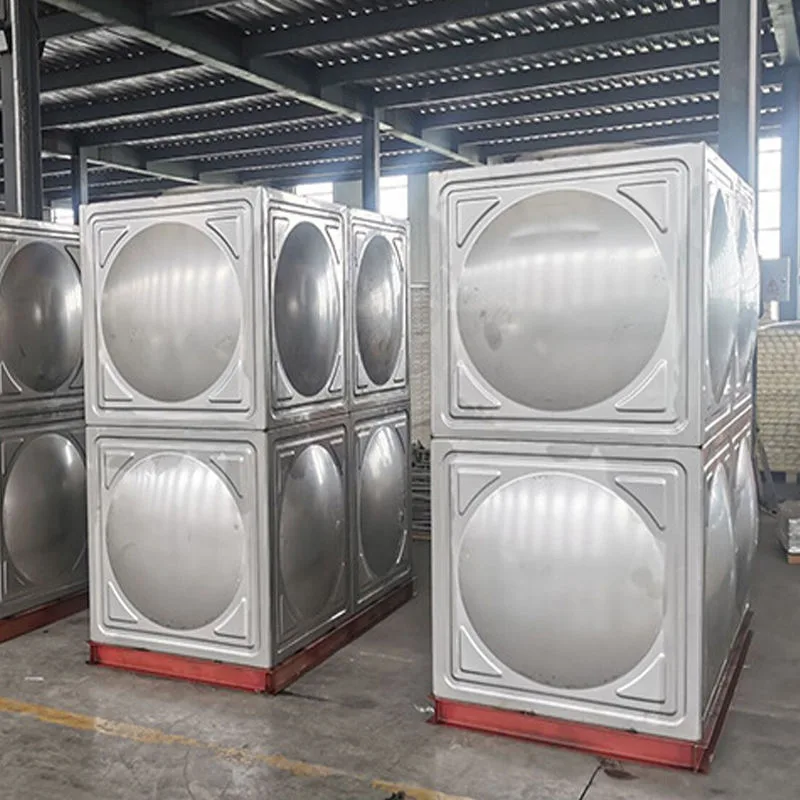 Insulated stainless steel storage tanks with piping at industrial facility