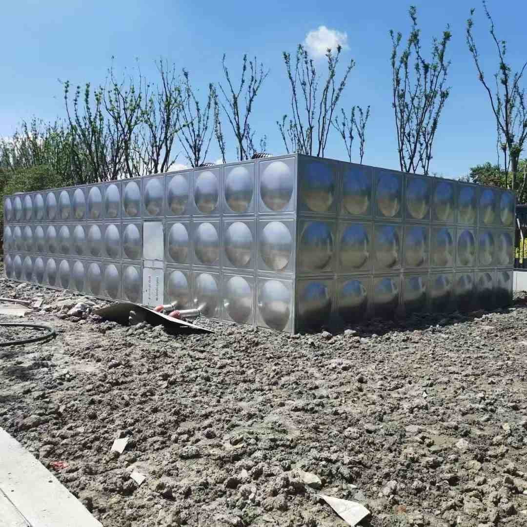 Row of stainless steel tanks in modern industrial production facility