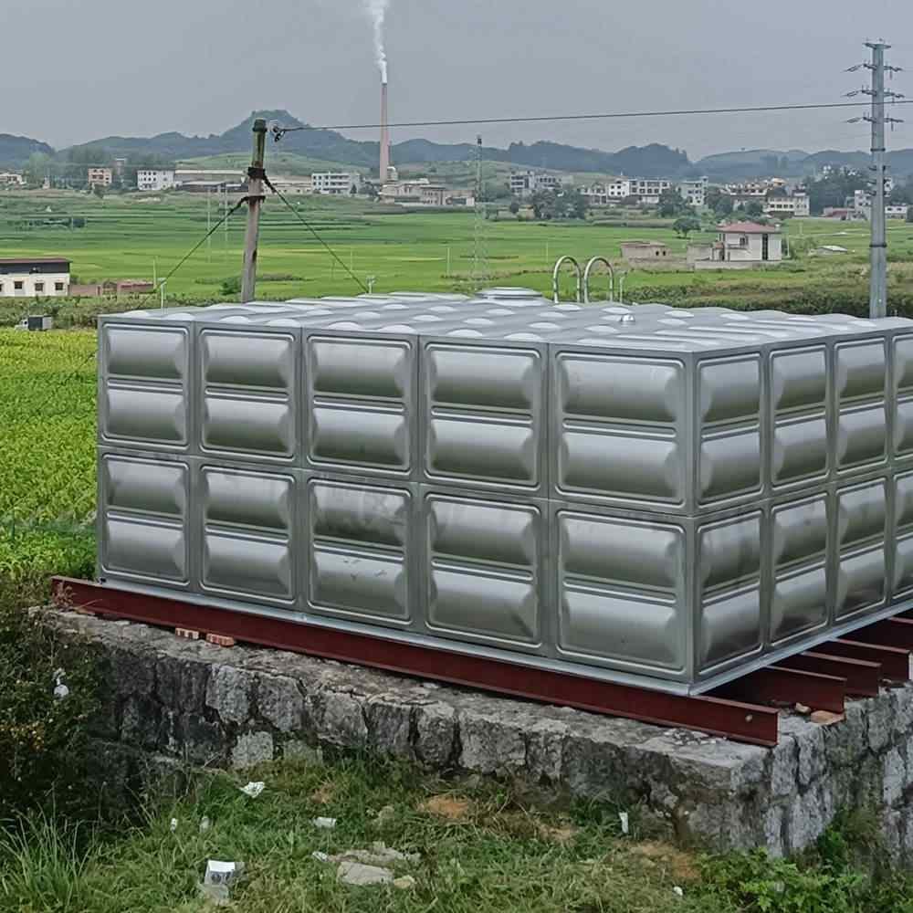 Large water treatment tanks under blue sky representing corrosion-resistant composite storage