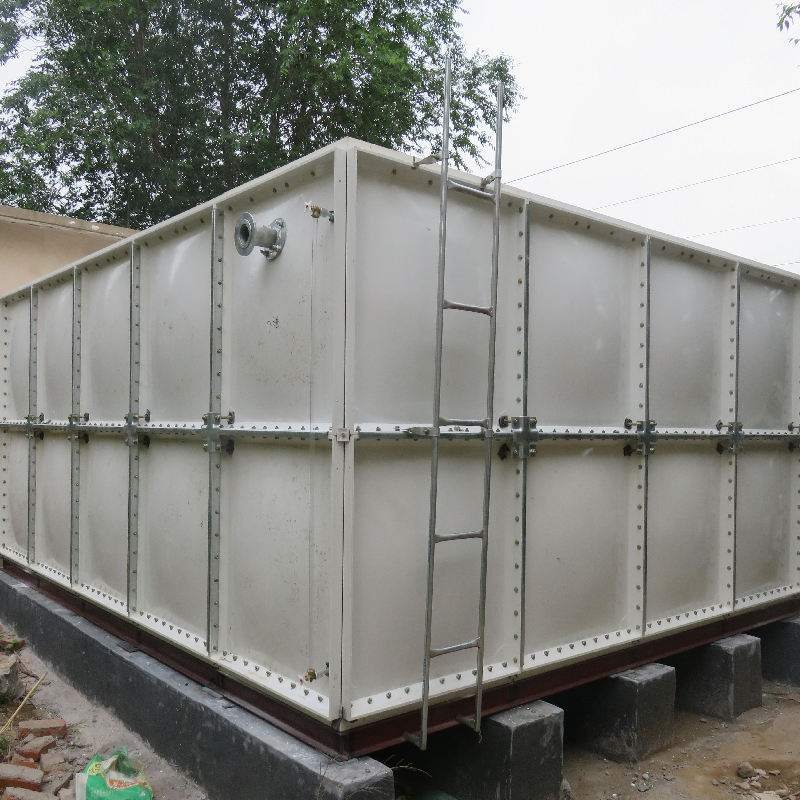 Row of stainless steel tanks in modern industrial production facility